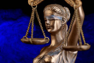 Bronze Themis statue - symbol of Justice - with negative space